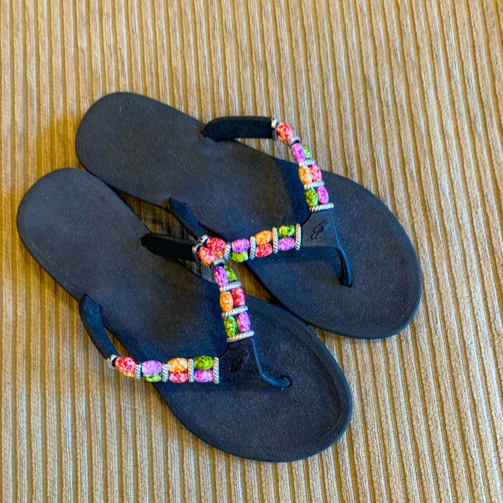 Unworn beaded flip flops